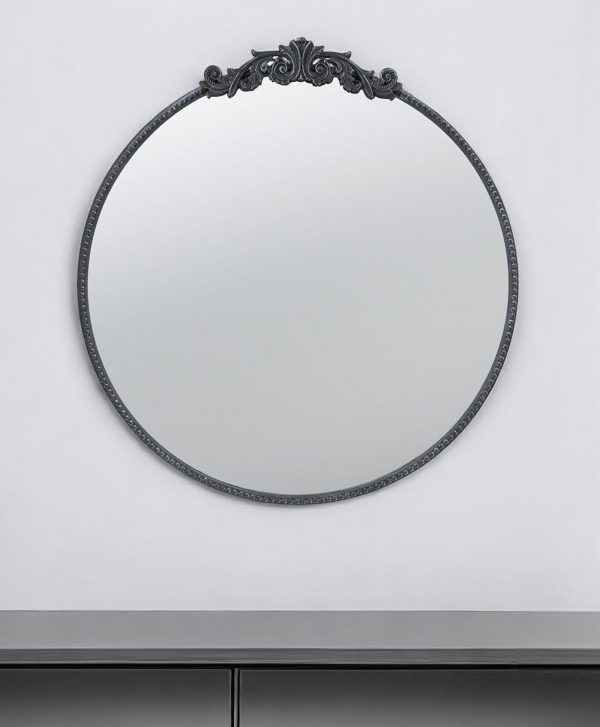 Homeroots - 32" Black Crowned Top Iron Framed Accent Mirror - Image 1