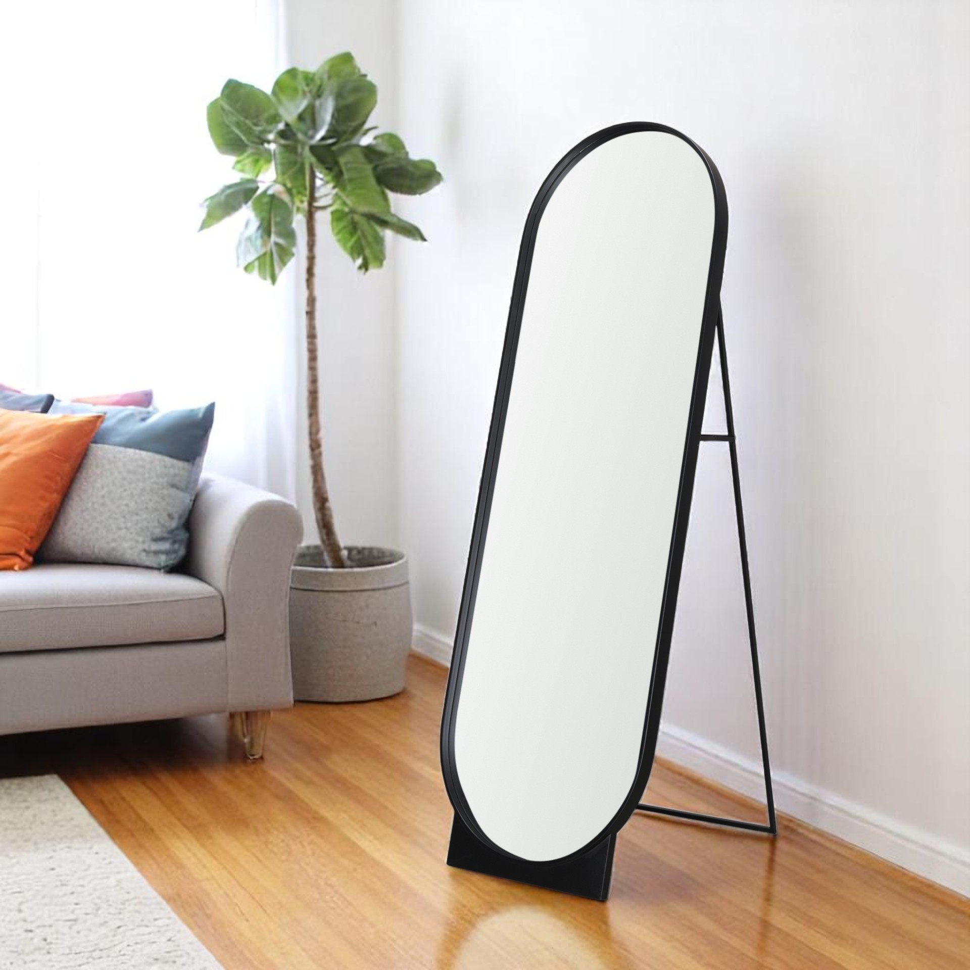 607288_6_h6UtFOCu Homeroots - 67" Black Metal Oval Freestanding Tilting Geometric Framed Standing Mirror - Image 1