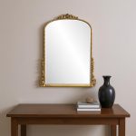 Homeroots - 34" Antiqued Gold Wood Baroque Arch Framed Accent Mirror